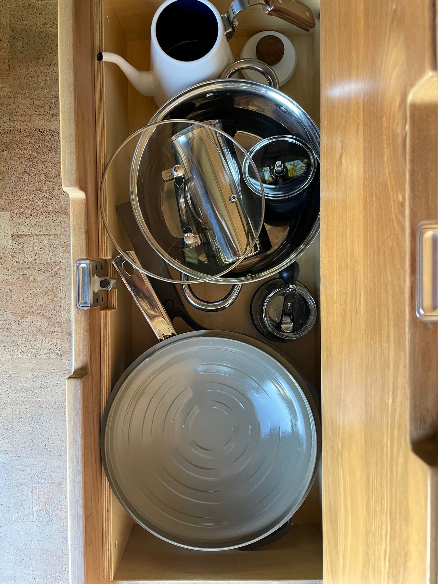 and built-in sink create a functional camper interior.|Explore this modern RV rental interior featuring a wood kitchen — photo 9