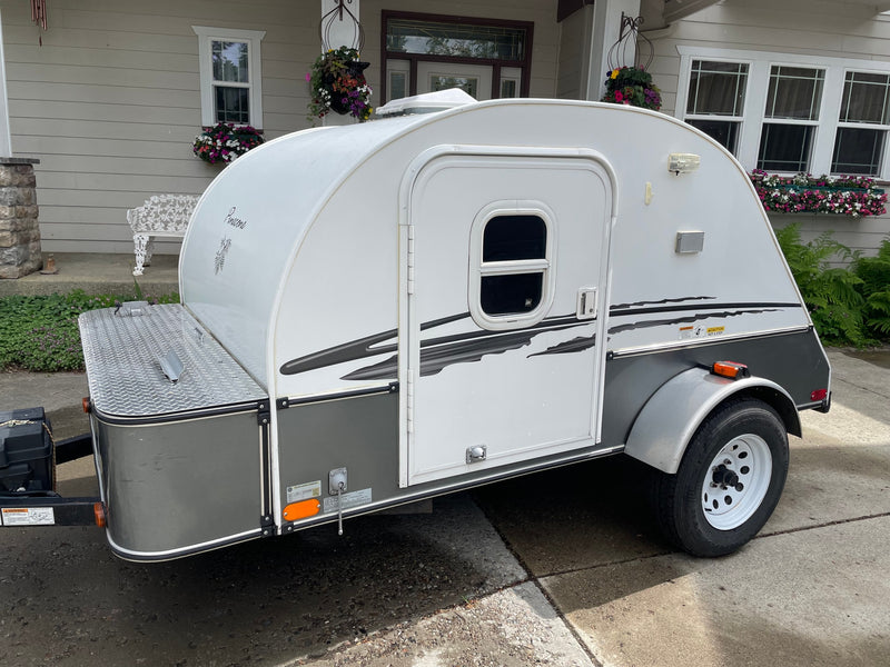 A white and gray teardrop travel trailer — photo 1