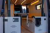 RV rental camper van: A well-appointed interior features a kitchen sink, Lagun table, power panel, & pull-out shower.