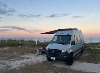  parked by a picnic table. Perfect for adventure!|An RV rental parked by the Reed Bingham State Park sign — photo 8