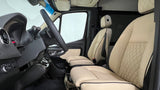 Step into luxury with our RV rental! This premium cockpit features quilted beige leather seats, modern controls, and ample space.