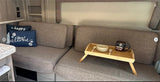  parked outside among trees. Ideal for road trips.|A welcoming rv rental interior: kitchenette