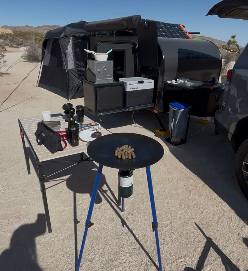  and off-road tires in a desert landscape.|A Boundless X3 tent and a "Flyer" camping trailer — photo 2
