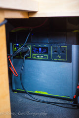 Inside an RV rental, a Goal Zero Yeti 3000X portable power station is seen, providing versatile power with its display and cords visible.
