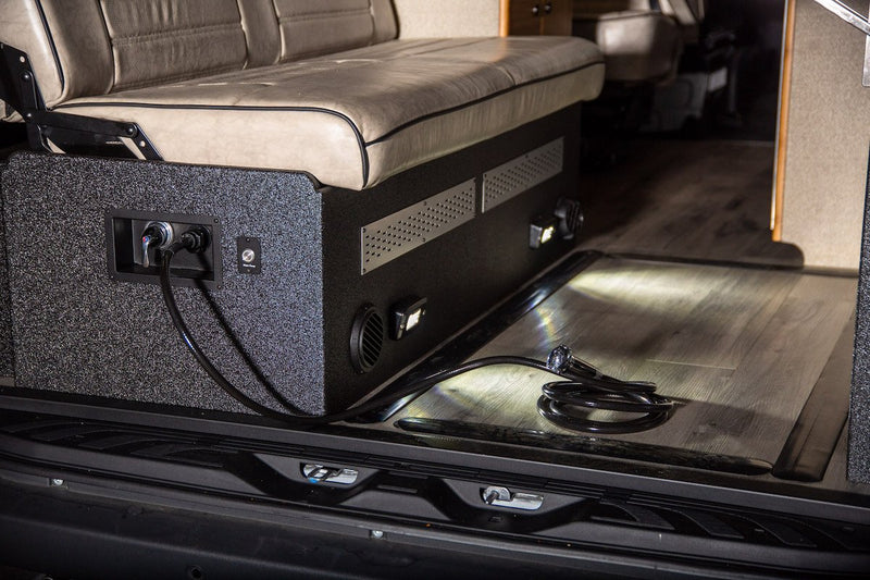  and ample storage for any trip.|Modern RV rental interior from rear: custom seating — photo 5
