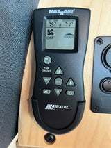 Maxxair vent fan remote in an RV rental, showing 71°F room temp, 75°F set temp, and fan off.