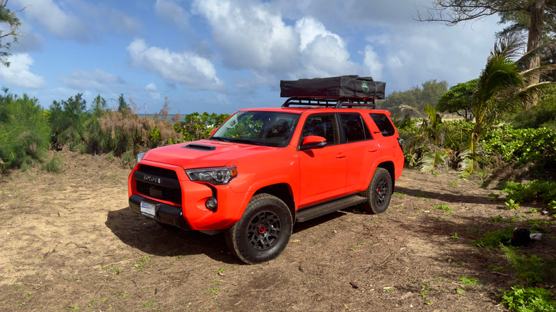 Orange 4Runner with rooftop tent, perfect for an RV rental adventure near the coast. — photo 4
