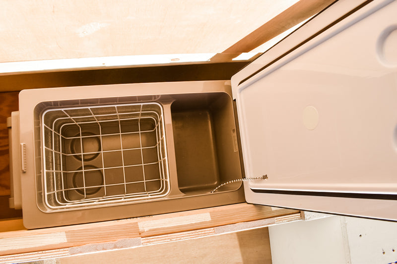 Portable RV rental cooler with lid open, showing wire basket & storage compartment. — photo 11