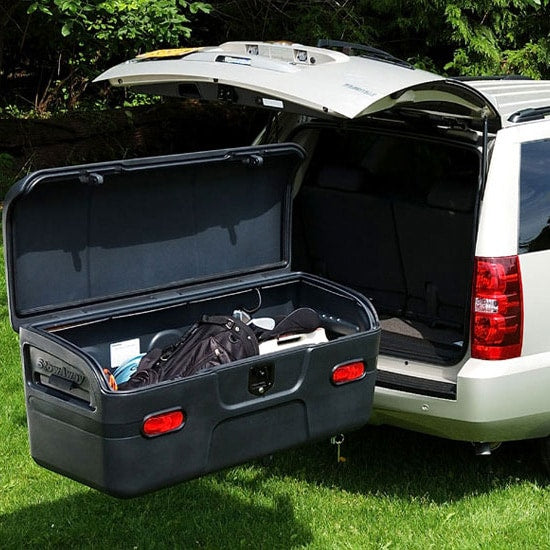 SUV with open trunk & hitch cargo box for golf gear. Perfect storage solution for your RV rental adventure!