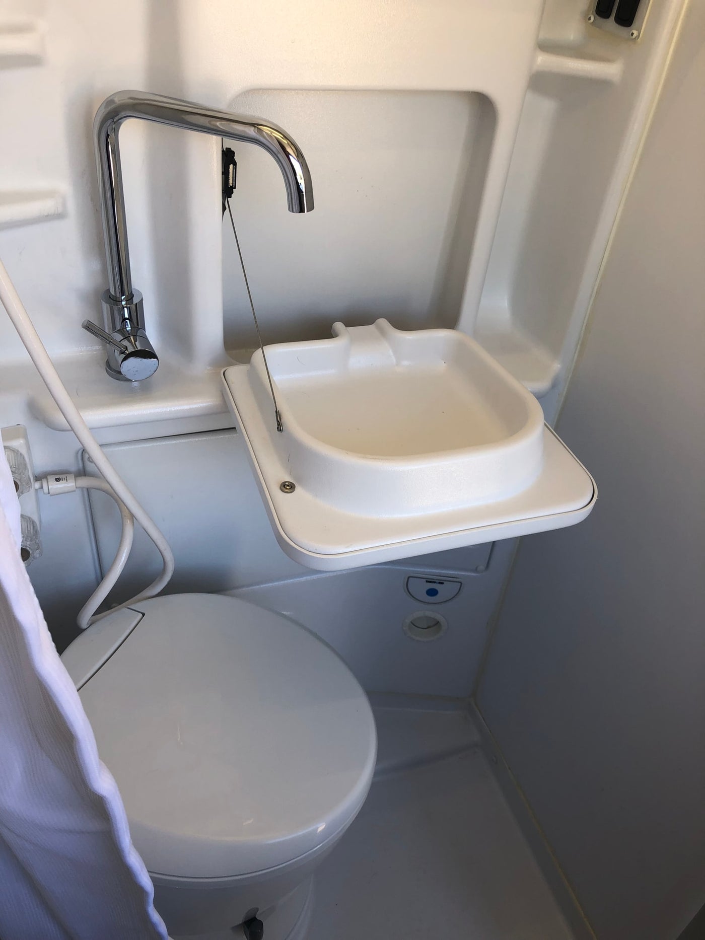  & open kitchen area for camping.|View inside an RV rental: This camper van features a kitchen with stove/sink — photo 15