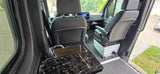 RV rental interior: A compact camper van with a black marble sink and chrome faucet, plus front swivel seats for versatile living.
