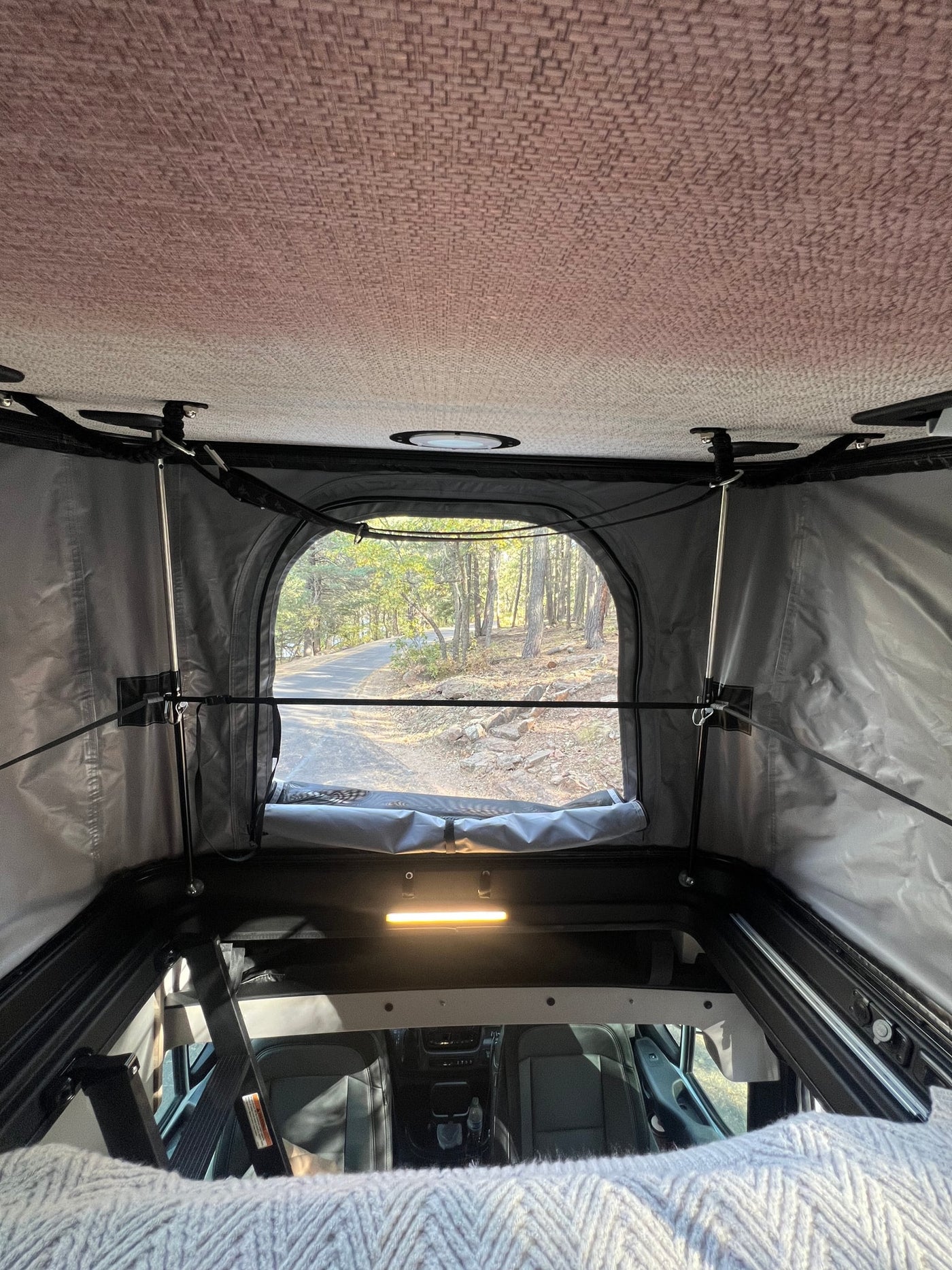  & overhead cabinets. Ready for travel!|An RV rental's inviting rear interior — photo 15