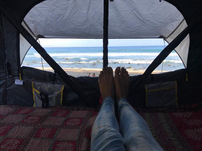  & lounge. Ideal setup for an RV rental trip by the sea.|This RV rental style setup features a Jeep Gladiator with a rooftop tent and outdoor kitchen — photo 5