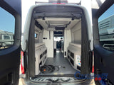 Rear view of an rv rental camper van, doors open to reveal its modular interior with benches, durable flooring, and a power cord.
