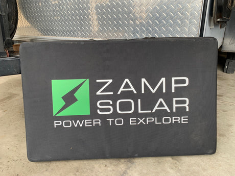 Black Zamp Solar case, with "Power to Explore" logo. Ideal portable solar power for RV rental adventures.