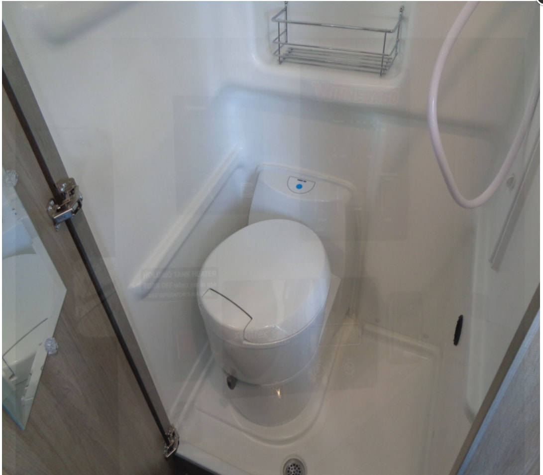  and overhead cabinets for cozy travel.|RV rental control panel featuring Truma heater — photo 7