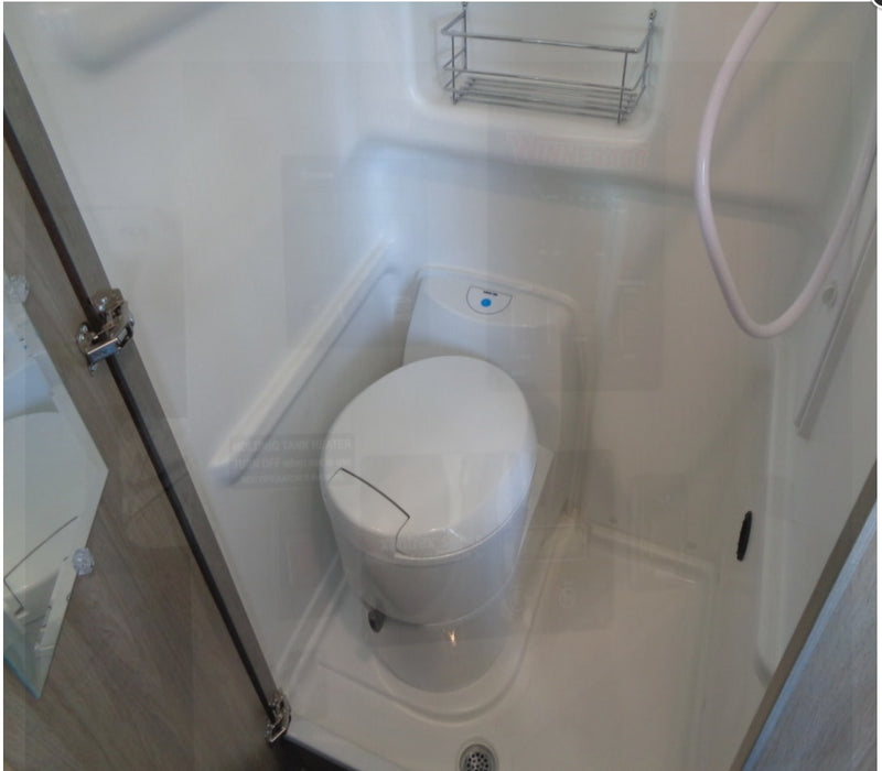  and overhead cabinets for cozy travel.|RV rental control panel featuring Truma heater — photo 7