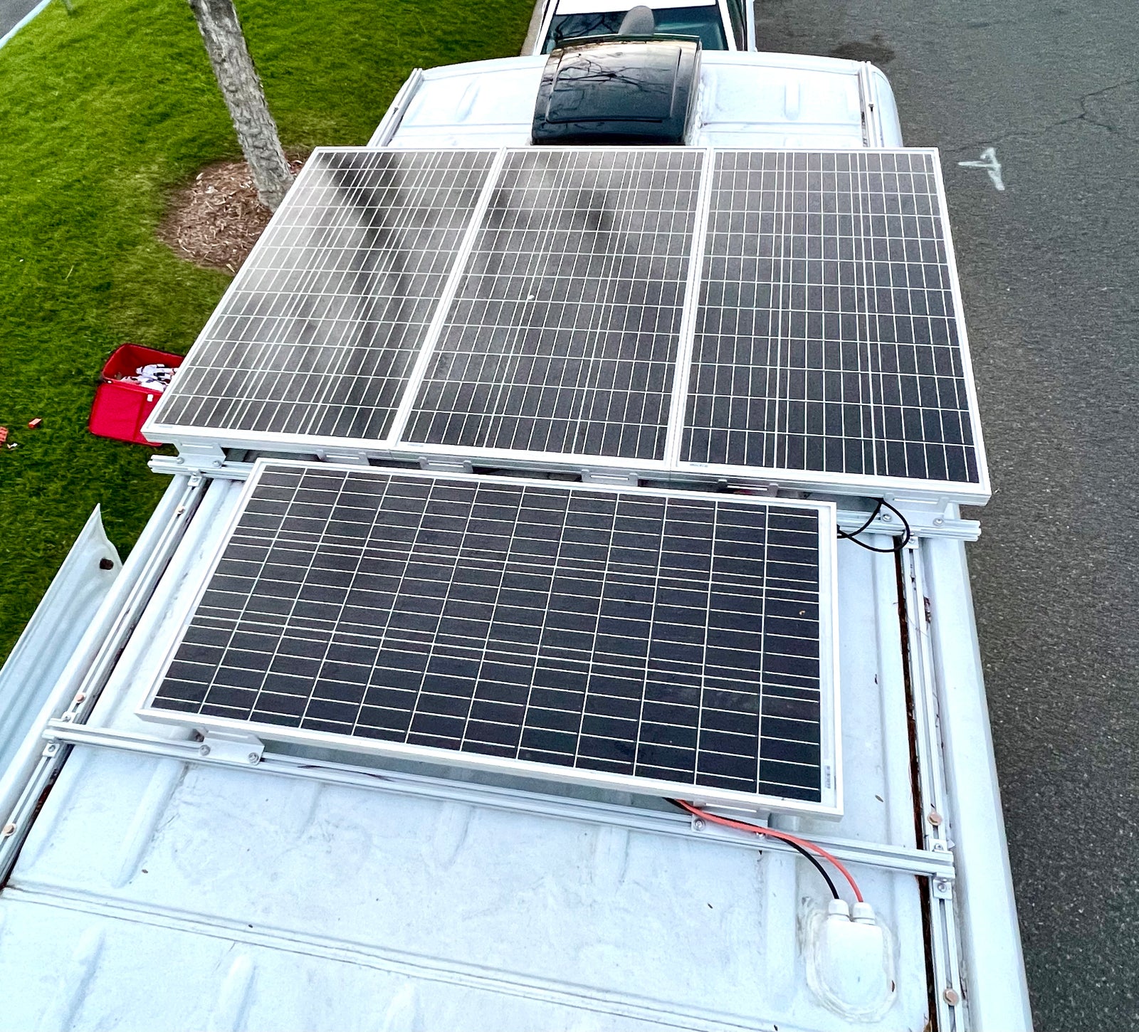 Four solar panels power this rv rental, enabling off-grid travel from its roof.
