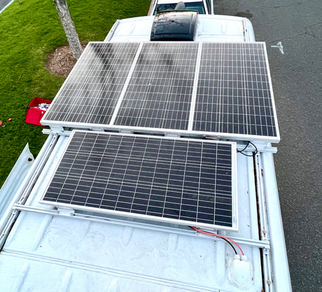Four solar panels power this rv rental, enabling off-grid travel from its roof.