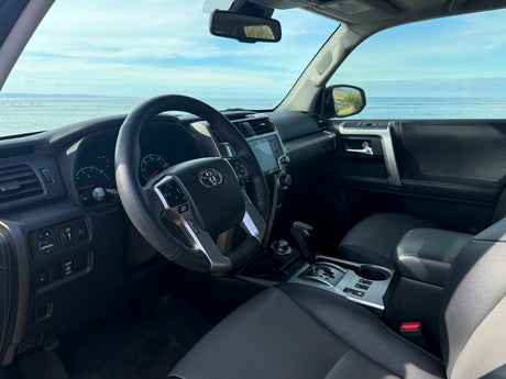 Inside an rv rental SUV with stunning ocean views. Ideal for a scenic road trip or coastal escape.