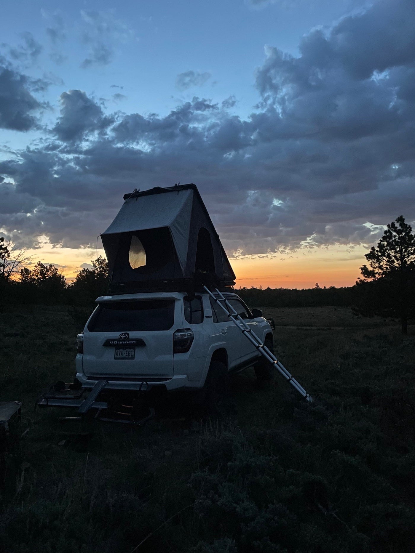 Dusk camp: White 4Runner SUV with rooftop tent & ladder, an RV rental alternative for overlanding. — photo 18
