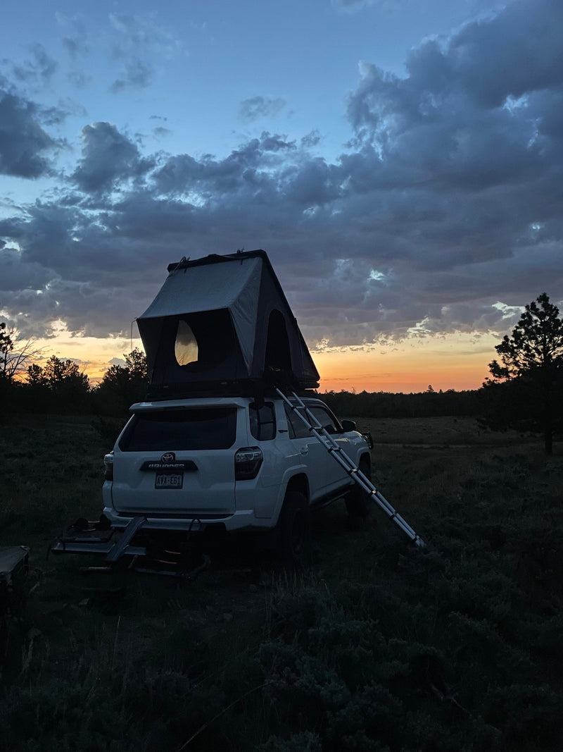 Dusk camp: White 4Runner SUV with rooftop tent & ladder, an RV rental alternative for overlanding. — photo 18