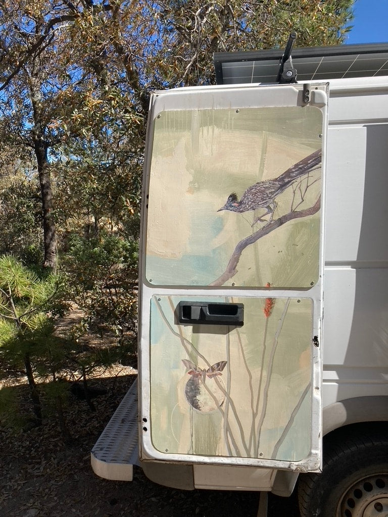  providing mobile storage next to the bed.|Inside an RV rental: a wooden kitchen counter with a stainless steel sink — photo 12