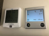 Two digital climate control panels for an rv rental: Elwell AIR8 shows 77°F; Alde shows 82°F, time & status.