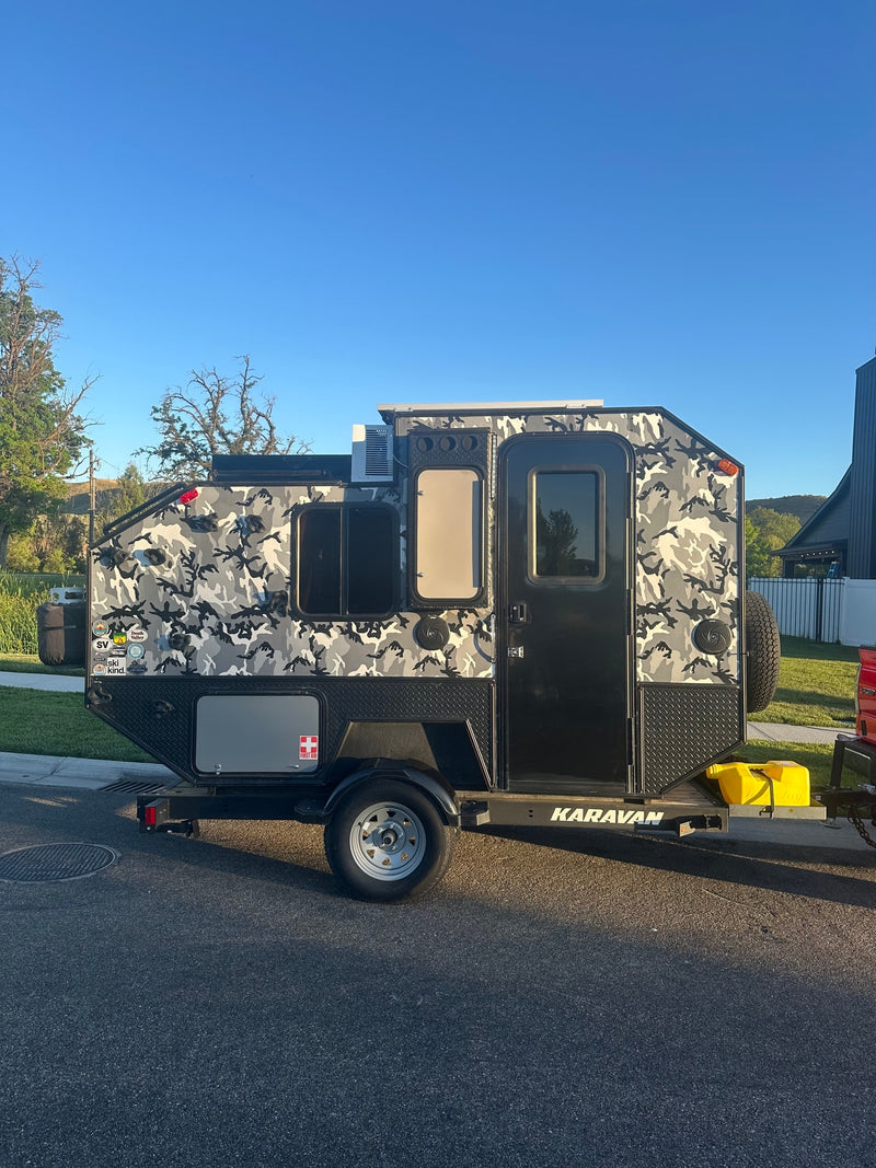  ideal for your next rv rental adventure.|Check out this unique camo Karavan off-road rv rental trailer — photo 2