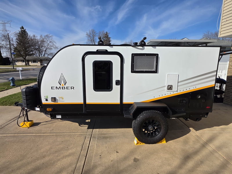 Ember E-Series Sparkle travel trailer, perfect for an rv rental, features solar panels, off-road tires, and rugged design. — photo 7