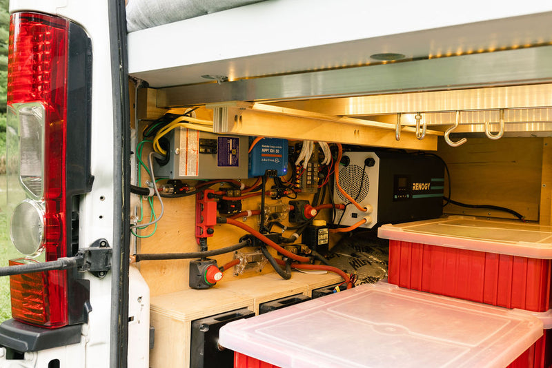 RV rental's custom electrical system: Renogy inverter, Victron solar charge controller, and batteries ensure off-grid power. — photo 9