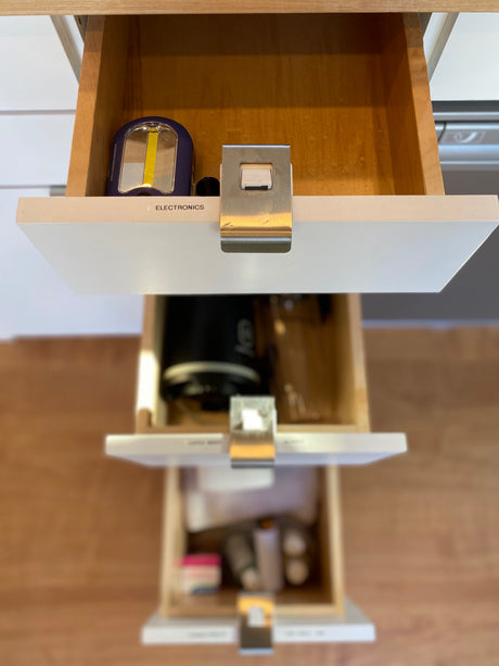 Efficient storage in an RV rental: electronics, personal items, and other essentials in organized drawers.