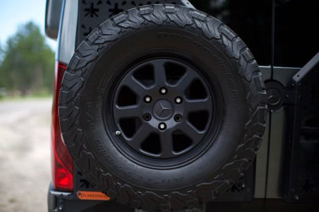 Black BFGoodrich spare tire on a Mercedes-Benz van, ready for your rv rental adventure.