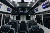 Experience luxury RV rental travel! Spacious custom van interior with quilted leather seating, microwave, and LED lighting.