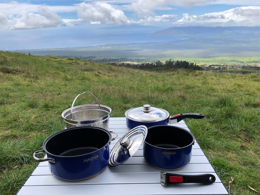 RV rental outdoor cooking: blue pots, pans, strainer on a table with a stunning ocean view from a grassy hill. Camp kitchen ready. — photo 12