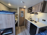  and green picnic table.|Organized rv rental drawer: two white nesting cutting boards