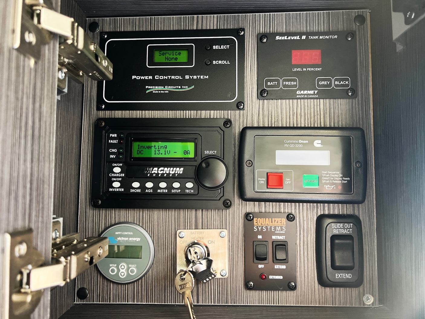 Essential RV rental control panel: power, tank levels, inverter, generator, and slide-out controls for your adventure.