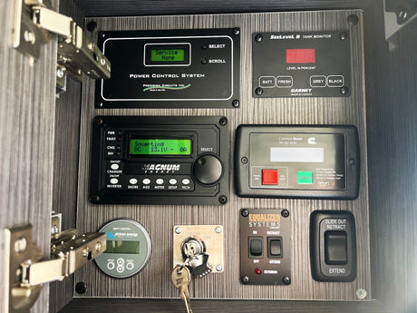 Essential RV rental control panel: power, tank levels, inverter, generator, and slide-out controls for your adventure.