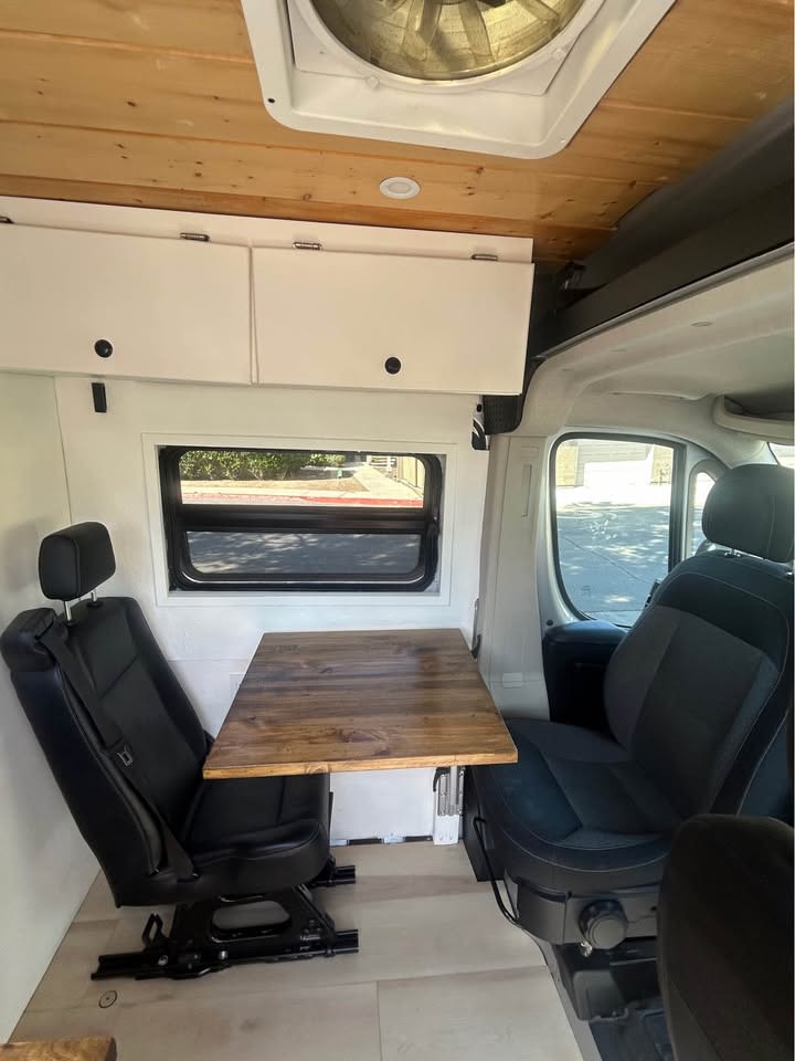  and wooden accents.|Cozy rv rental interior reveals a person — photo 4