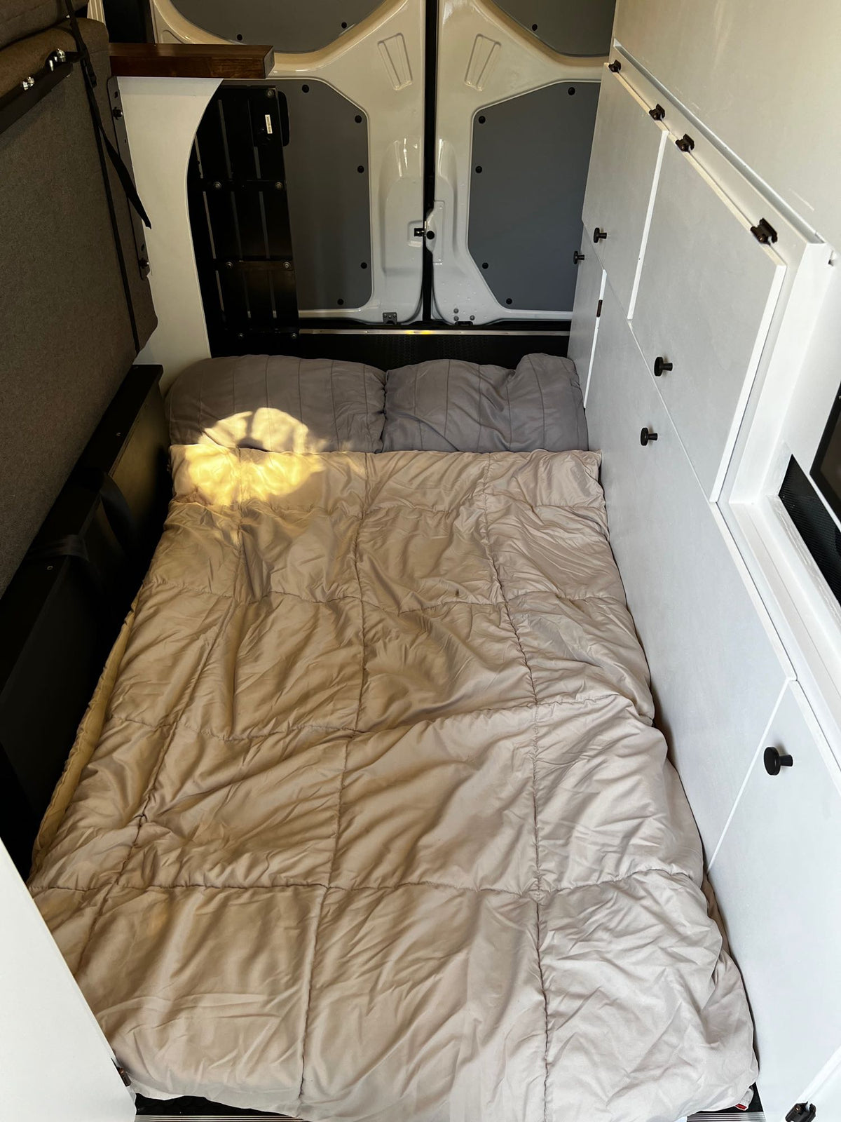  and cooktop.|Step inside this inviting rv rental van conversion — photo 8