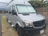 Silver Mercedes Sprinter RV rental, ideal for a Hawaii adventure.