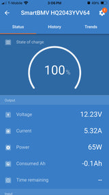 RV rental power display: 100% battery, 12.23V, 65W output. Battery monitor app for camper power management.