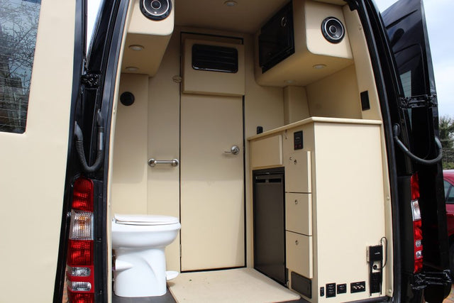  and rear beds with a kitchen.|Silver Mercedes-Benz Sprinter RV conversion van