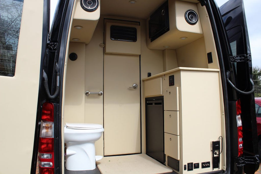  and rear beds with a kitchen.|Silver Mercedes-Benz Sprinter RV conversion van