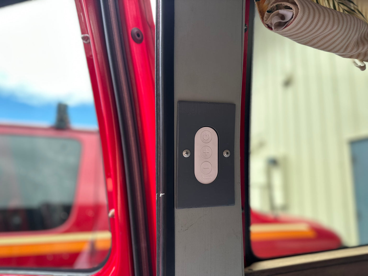 An RV rental interior shows a Govee control panel with power, plus, and minus buttons, likely for lighting or climate.