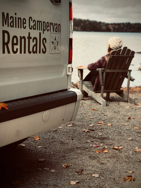Serene fall lakeside retreat. This Maine Campervan RV rental offers perfect relaxation by a picturesque lake.