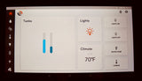 Digital control panel in an **rv rental** displaying tank levels, climate settings (70°F), lights, and water pump.