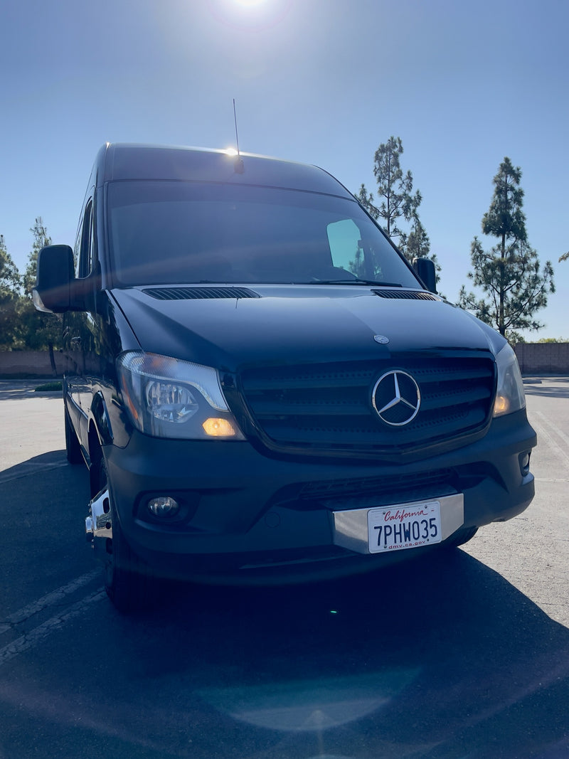 Black Mercedes-Benz Sprinter van, perfect for your next rv rental adventure. Sunny day, CA plate. — photo 11
