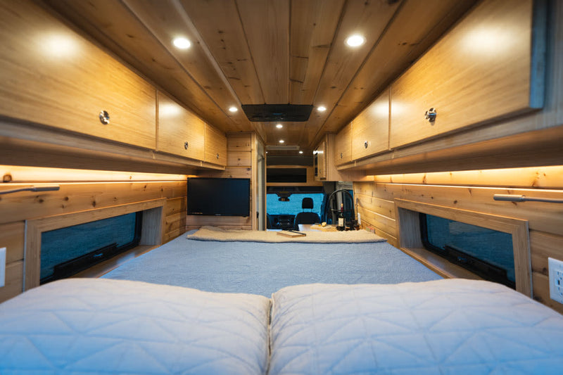  featuring a cozy wood-paneled living area with a bench — photo 12