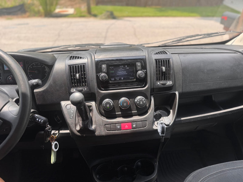  and a gas connector.|Inside an rv rental with a rustic wood ceiling — photo 11